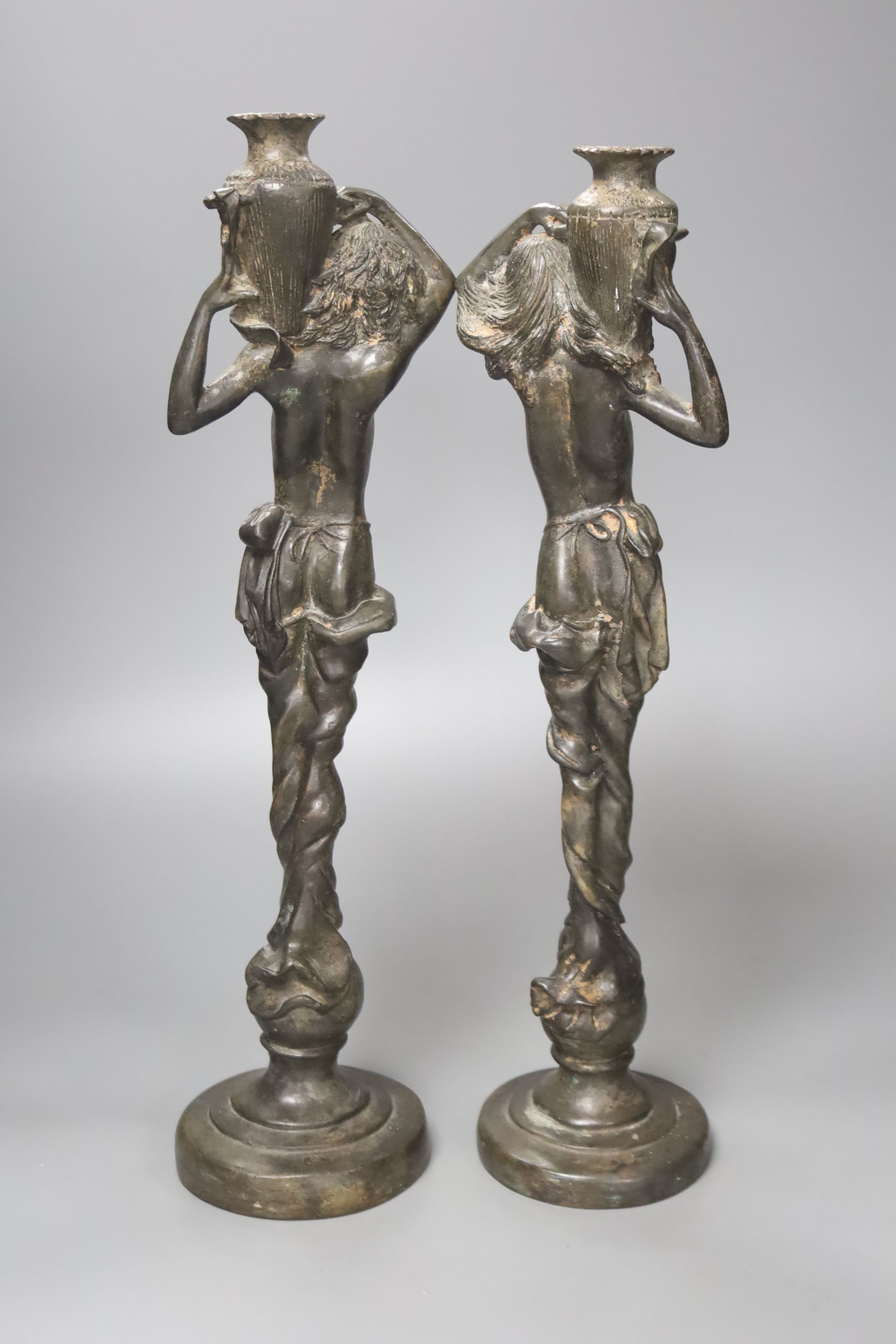 A pair of spelter figural water carriers, 42cm high